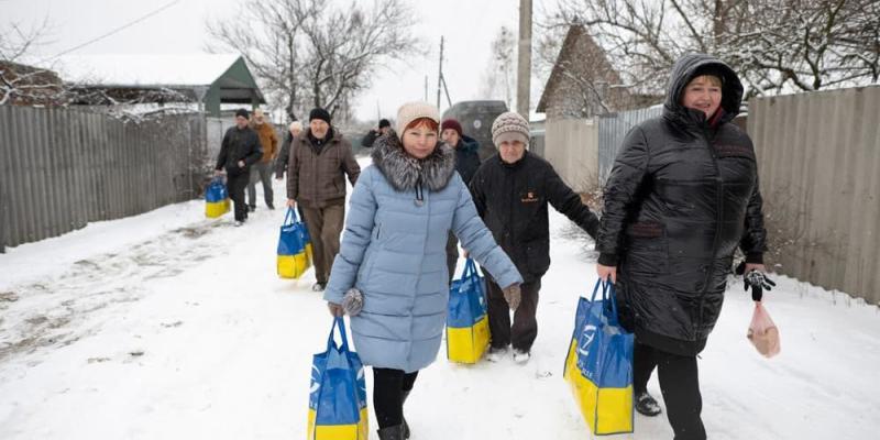  “We've received food many times from Samaritan's Purse,” Galyna* said (in blue jacket). “I'm incredibly thankful to the people who make this possible.”
