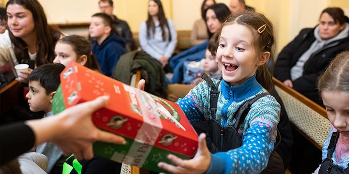Child receiving shoebox gift in Ukraine