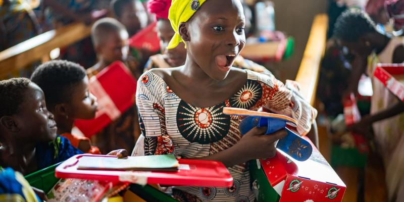 girl in Benin with new shoes