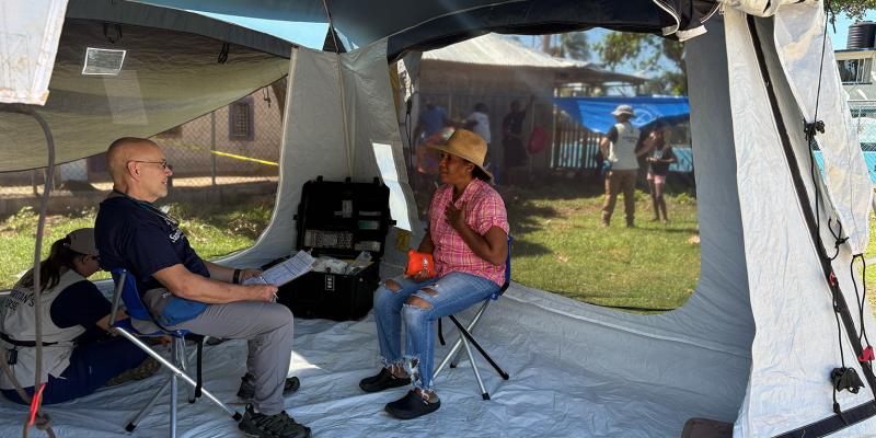 INSIDE THE MOBILE MEDICAL TENT, MICHELLE MET WITH A DOCTOR WHO PRAYED WITH EACH PATIENT who came through for care. The opportunity to speak with someone and receive treatment brought her welcome relief after long days of strain.