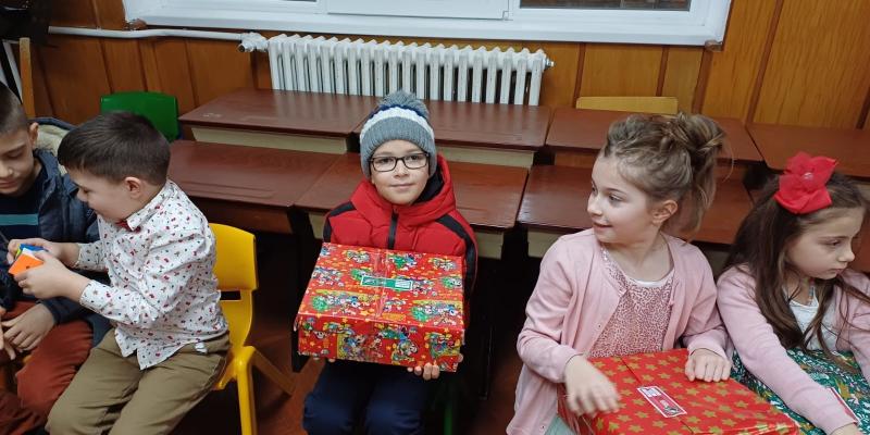 Delight and excitement for these boys and girls as they receive their gifts!