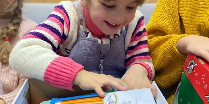 This girl’s delight was written all over her face as she unpacked her box full of treasures. 