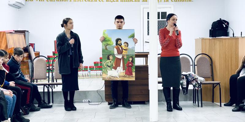 Church partners deliver a fun and simple Gospel presentation at an outreach event.