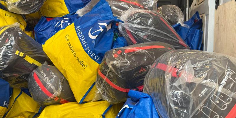 Emergency kits with “God loves you” printed in Ukrainian on the side of them.