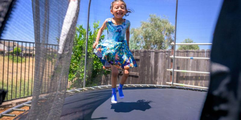 After her surgery, Dara displays her heart’s new strength by jumping on a trampoline.