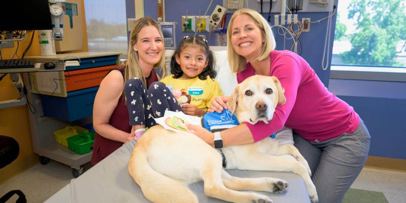 The Sutter Health team, including therapy dog Feather, encouraged Dara surrounding the procedure.