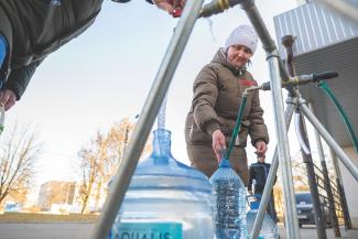 women at water station