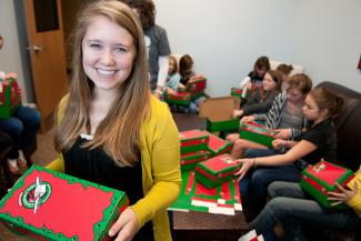 Girl holds shoebox gift