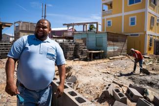 Hector checks out the progress on their new home that is being built.