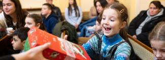 young girl in Ukraine receiving a shoebox