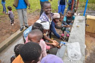 Handwashing stations and latrines were also constructed to promote good hygiene and to protect the precious ground water.