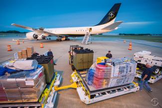 Samaritan's Purse workers preparing to load a plane with relief materials