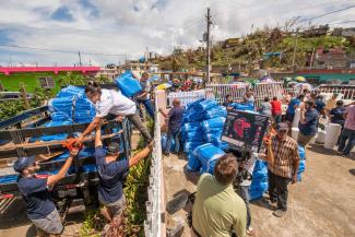 Samaritan Purse Volunteers distributing life-saving relief to those in a crisis affected area