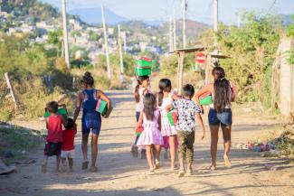 Children heading home with their shoeboxes after an inspiring fellowship session