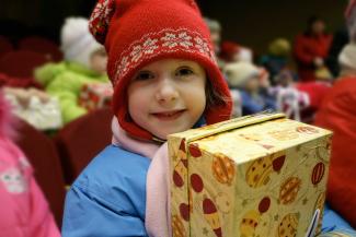 child hugs shoebox