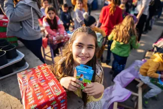 Little girl excited to receive shoebox gift 