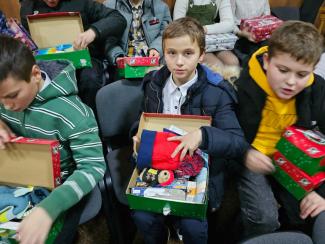 child holding a shoebox