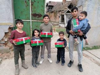 Group of children with shoebox gifts