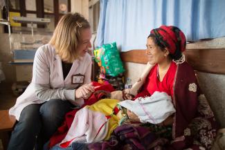 Volunteer Doctor with a patient