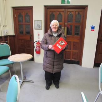 Pat Lawrie holding shoebox