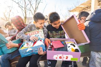 boys explore shoebox gifts