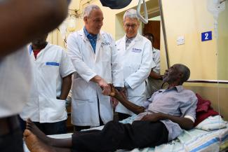 DRS. HELLWARTH, LEFT, AND MCCLUSKEY, RIGHT, VISIT JEPHITHER FOLLOWING HIS SUCCESSFUL SURGERY.