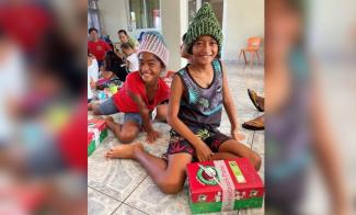 Children from a neighborhood in Papeete, Tahiti, rejoice to receive gift-filled Operation Christmas Child shoeboxes.