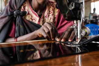 It takes time for the fingers and foot to work in sync, but three weeks in and Mary’s confidence has grown with the foot-operated machine.