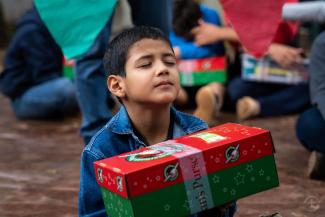 Each child has the opportunity to accept Jesus as their personal Lord and Saviour before opening their shoebox gift.