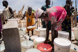 Nya joins others in the queue at the local water point–one of several Samaritan’s Purse has established in the community.