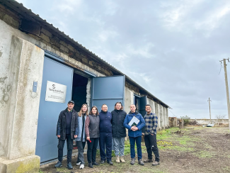 STAFF celebrated with farmers the completion of a grain storehouse.