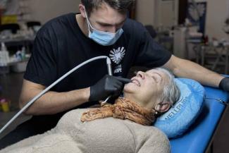 The dentist cleaned and polished Oleksandra’s teeth, a service she’d been forced to go without for three years.