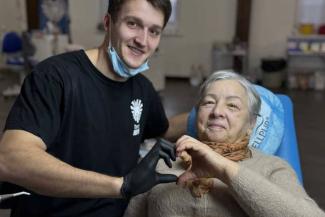 A member of Samaritan’s Purse mobile dental unit offers his services—and ultimately, hope—to a patient in eastern Ukraine.