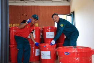 Partner staff unload buckets stuffed full with Samaritan’s Purse relief supplies to distribute to families in Vietnam reeling from Typhoon Kajiki.