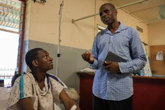 Pastor Babangida (right) tells Umaru about the good news of Jesus Christ for the first time. Many patients our surgeons operated on came from far, remote areas where the Gospel is not known.