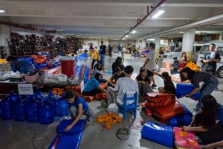 Teams are fashioning shelter kits that include tarp, cordage, and other elements for keeping families dry and warm.