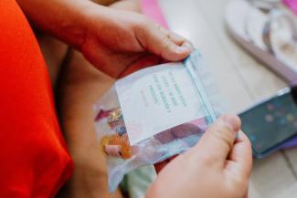 Printed on a bag of health supplies, Jeremiah 29:11 reminds each mother who comes to the Samaritan’s Purse clinic that God has a perfect plan for them.