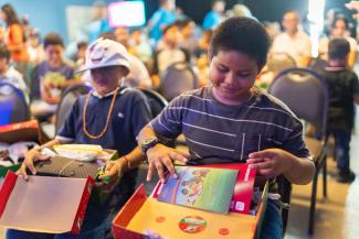 Edward was excited to receive his shoebox gift and to learn about Jesus Christ.