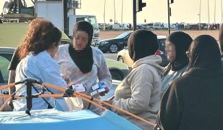 A church partner distributes aid to women who have found safety in Beirut.