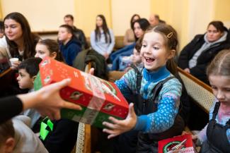 Each year, Operation Christmas Child collects and then distributes millions of shoebox gifts to children from around the world to share about the love of Jesus Christ with them. 