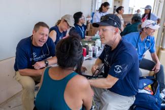 At schools and churches around the island of Saipan, Samaritan’s Purse mobile medical teams are meeting the immediate health needs of families displaced by the typhoon while sharing the hope of the Gospel with each patient.