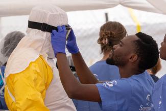 The donning and doffing of Personal Protective Equipment is an exact protocol for medical personnel treating patients in our Ebola Treatment Centres.