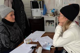 Oksana shared with the mobile medical unit staff how she fell from a cherry tree at age 8 and suffered a spinal injury that has since intermittently affected her speech.