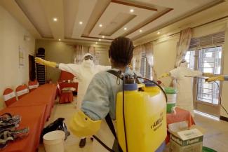 Medical workers practise chlorine disinfection techniques during infection prevention and control training.