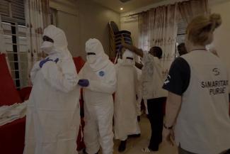 Local medical staff learn proper donning and doffing procedures during PPE training conducted by Samaritan’s Purse.