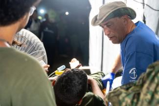 Emergency Field Hospital staff are treating a number of patients injured as they searched rubble after the initial seismic events.