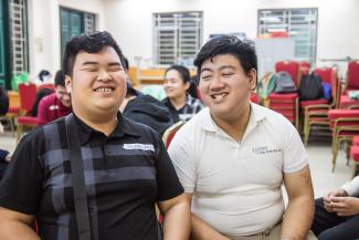 Cuong (right) is developing deep friendships at school.
