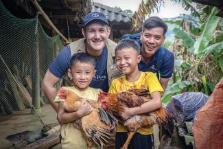 Children in Vietnam are helping their families raise poultry and livestock.